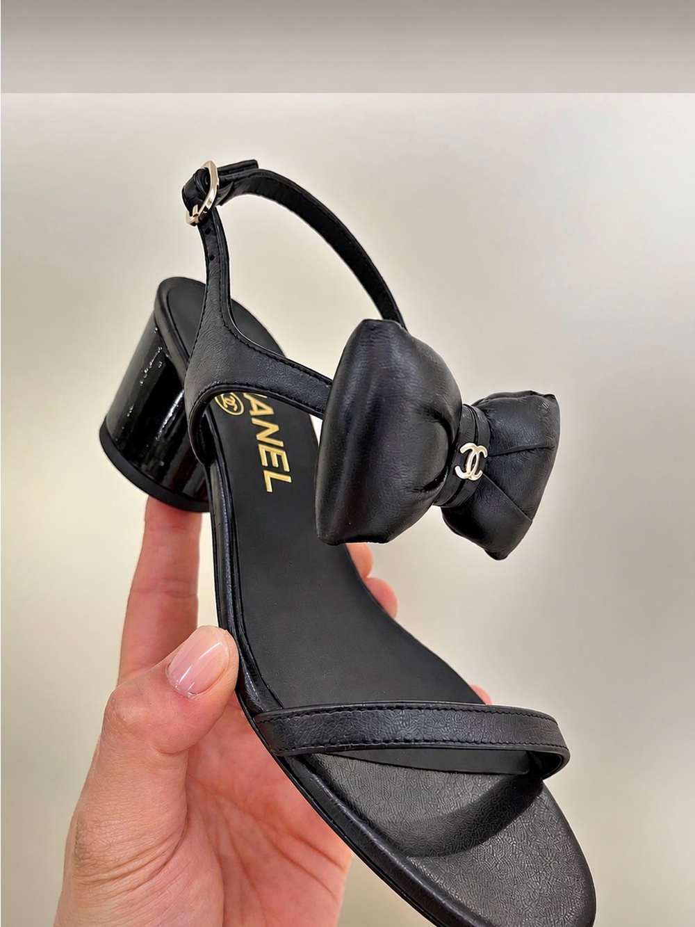 CHANEL Black Leather Bow Slingback Sandal with Logo Accent